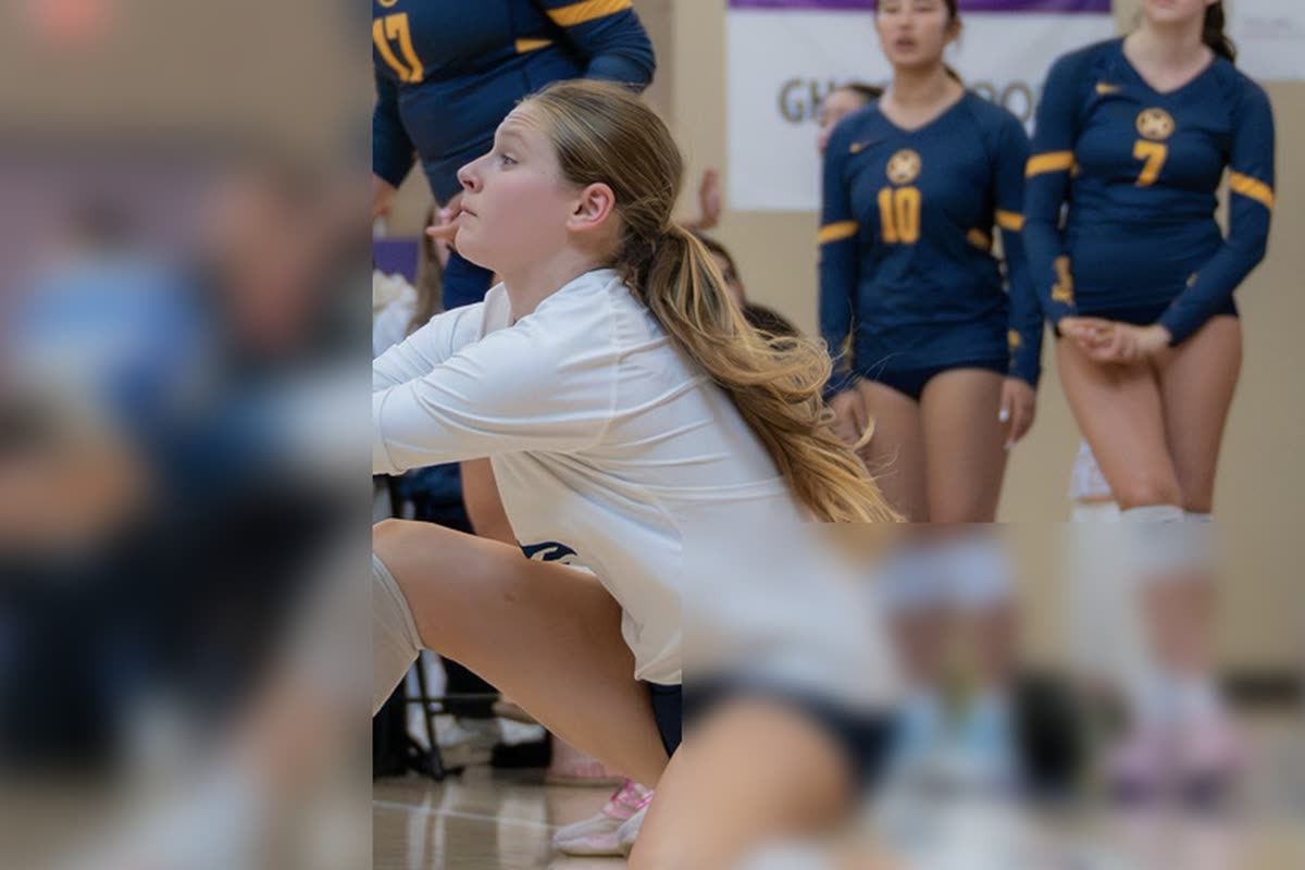 Young volleyball player passing on an indoor court